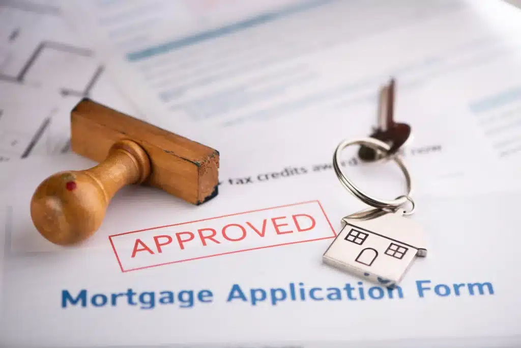 Pre approval An approved Mortgage loan application form with house key and rubber stamp close up from a Mortgage Lender Near Me